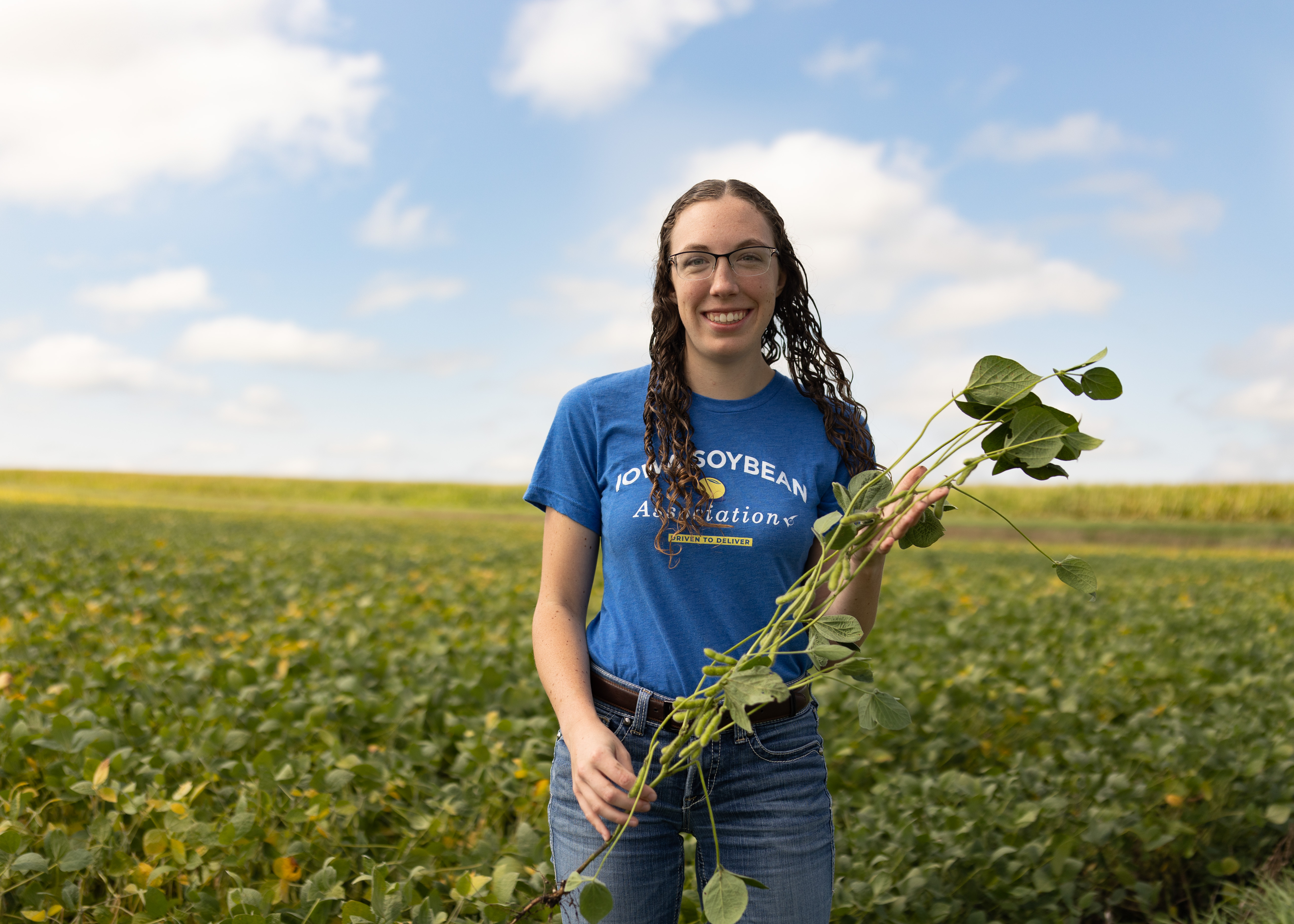 Conservation agronomist standing in a soybean field.