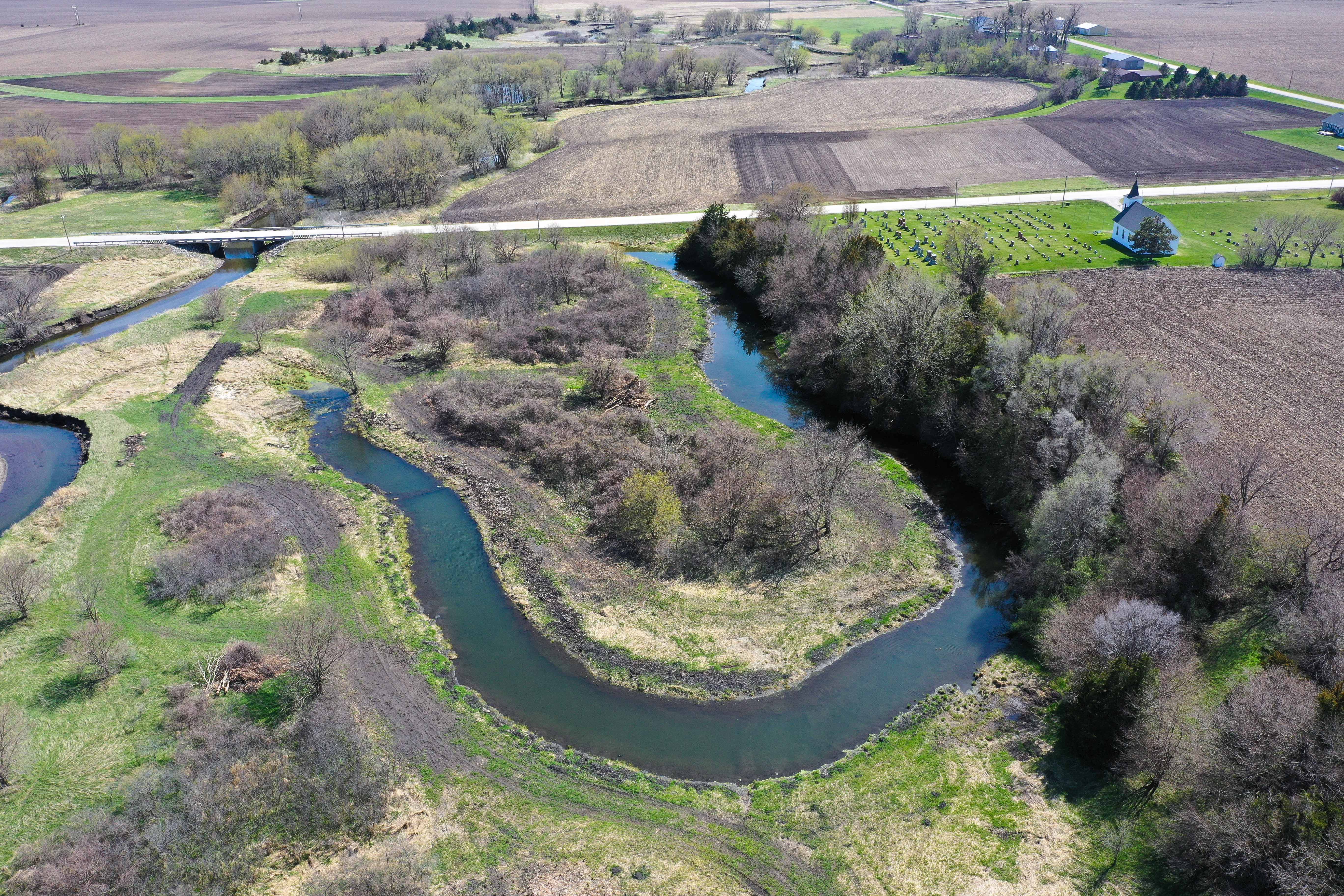 Restored oxbow near a river, surrounded by fields